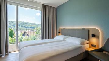 Standard Double Room, Garden View | In-room safe, desk, laptop workspace, blackout curtains