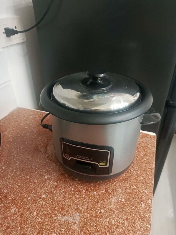 A slow cooker on a countertop.