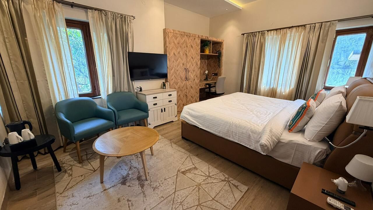 Deluxe Room, Hill View | Minibar (some free items), desk, laptop workspace, iron/ironing board