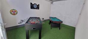 A room with a foosball table, a pool table, and a dartboard. - Dramalj luxury villa - pool, whirlpool & sea view (Dramalj)
