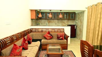 Deluxe Apartment, Non Smoking, Kitchen | Living area