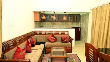 Deluxe Apartment, Non Smoking, Kitchen | Living area
