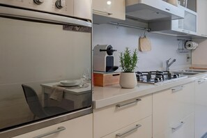 Fridge, microwave, oven, stovetop - Refined & Bright Modern Apartment near Porta Nuova (Turin)