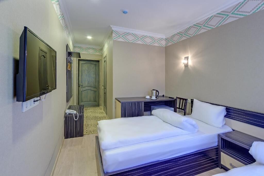 Chambre Économique avec lits jumeaux, vue cour intérieure | Literie hypoallergénique, minibar