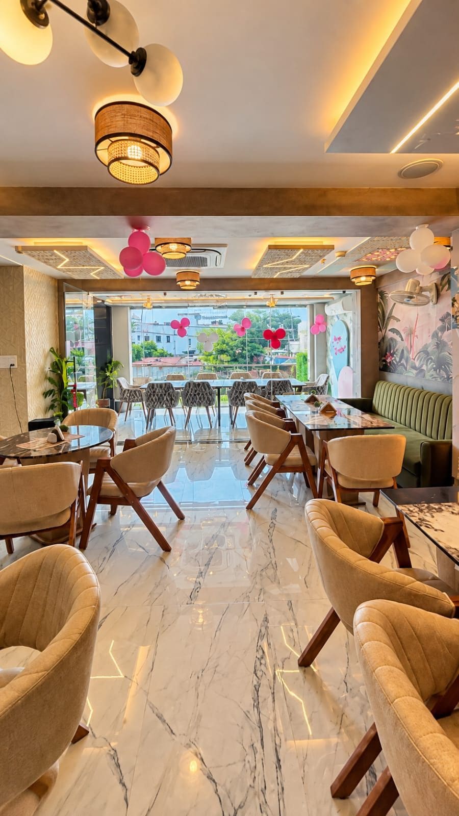 A modern dining area with a marble floor, round tables, and cushioned chairs.