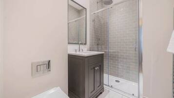 Shower, hair dryer, towels, shampoo