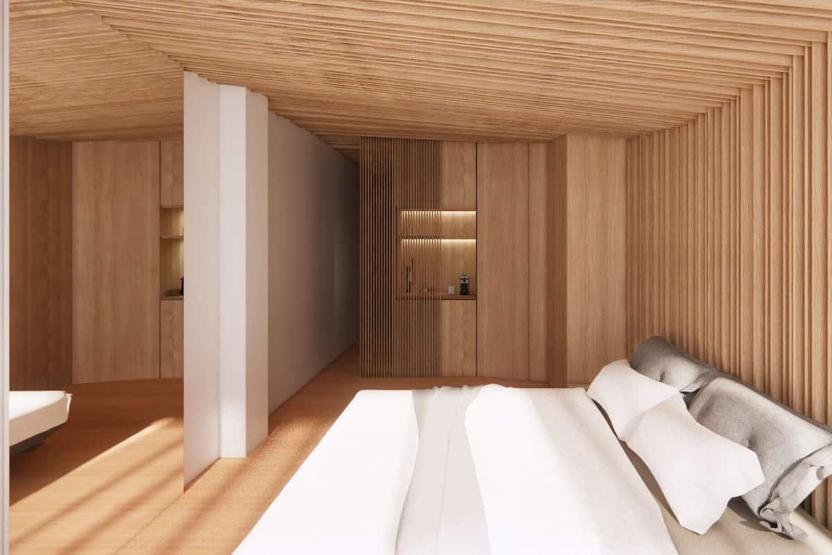 Ein modernes Zimmer mit einer Holzboden-Decke, einem Bett mit weißer Bettwäsche und einem Holzschrank.