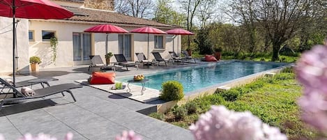 Seasonal outdoor pool, open 9:00 AM to 7:00 PM, pool umbrellas