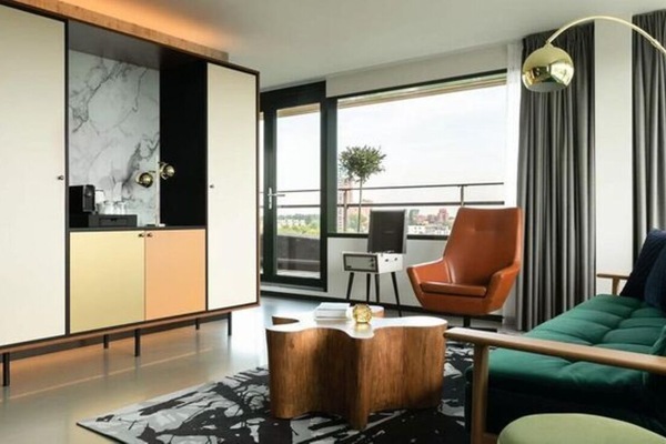 Lounge by expansive windows and soak up leafy views.