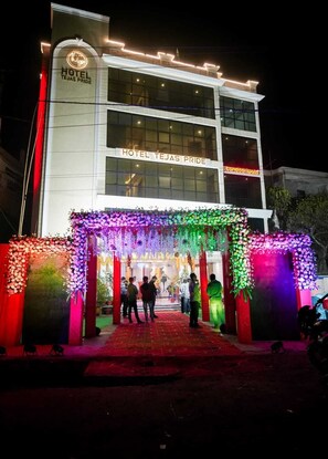 A hotel with a modern facade, a prominent entrance, and a sign reading 'HOTEL TEJAS PRIDE.' - Hotel Tejas Pride (Bhadrak)