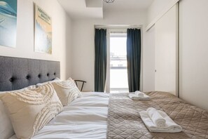 1 bedroom, desk, iron/ironing board, travel crib