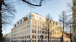 A multi-story building with a flat facade, large windows, and a corner entrance. - Come in! `Värjäri` Parvellinen asunto Pyynikillä (Tampere)