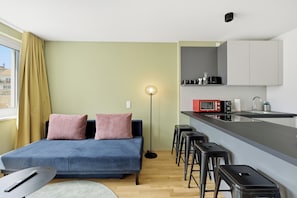 Comfort-Apartment | Wohnbereich | 50-Zoll-Smart-TV mit Satellitenempfang, Netflix, Fußbodenheizung