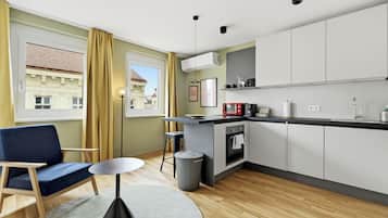 Deluxe Studio | Living area | 50-inch Smart TV with satellite channels, Netflix, heated floors