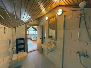 Shower, hair dryer, towels, soap