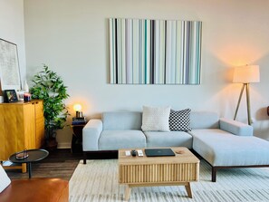 Living area - Spacious Beach Getaway w/ Ocean Views + Balconies - Walk to Everything (Carolina Beach)