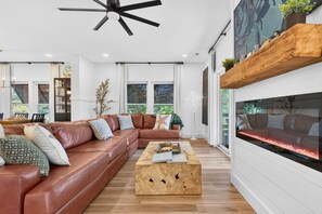 Smart TV, fireplace - Harbor Lights Resort | Private Waterfront Escape w/ Heated Pool, Dock & Sauna | Golf Cart to Beach! (Oak Island)