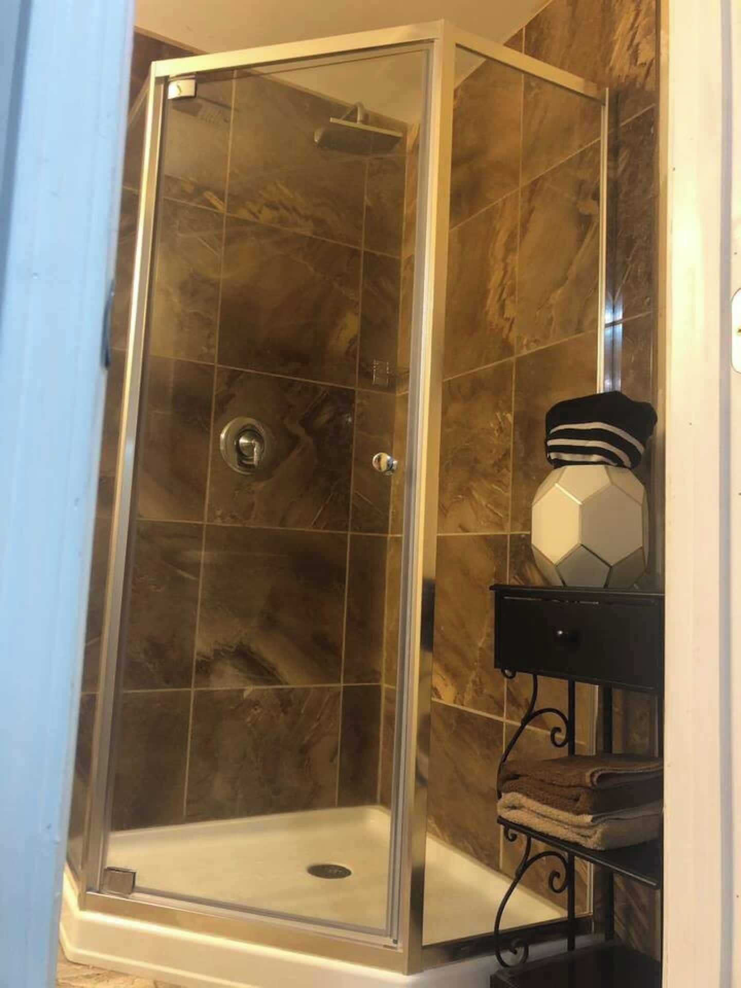 Shower, hair dryer, towels, soap