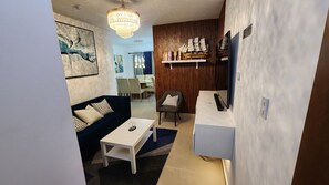 Living area - King Bed_ 24/7 Security_ Inverter_ Cozy Patio (Santiago de los Caballeros)