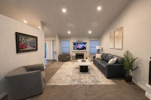 A living room with a fireplace, a television, and a sofa. - Entire Upper Level Home w/Fast Wi-Fi •20 Min SEA, Parking (Kent)
