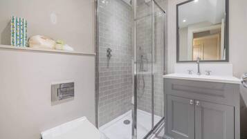 Shower, hair dryer, towels, shampoo