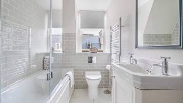 Shower, hair dryer, towels, shampoo