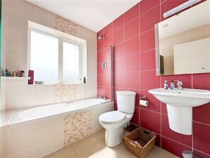 Combined shower/bathtub, deep-soaking bathtub, towels
