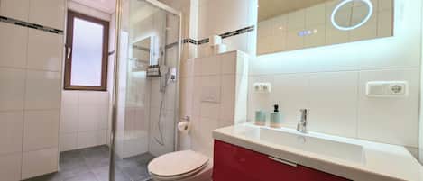 Shower, eco-friendly toiletries, hair dryer, towels