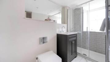Shower, hair dryer, towels, shampoo