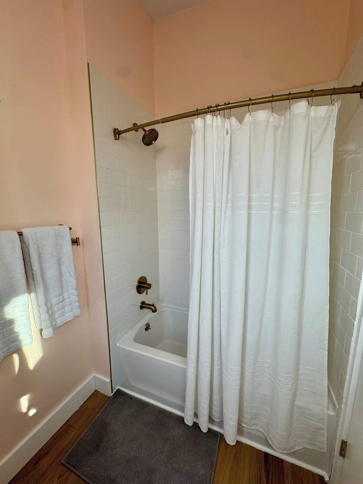 Shower, hair dryer, towels, shampoo