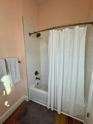 Shower, hair dryer, towels, shampoo