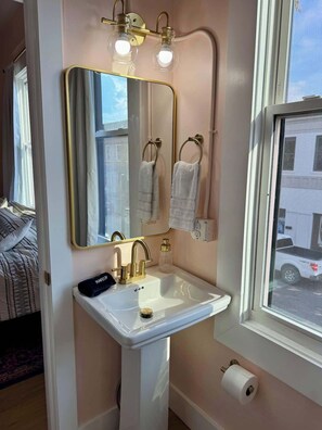 Shower, hair dryer, towels, shampoo