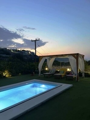 A swimming pool with a canopy and lounge chairs. - Elva Luxury Villa With Private Pool (Hersonissos)