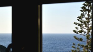 A coastal view with rocky terrain and a pine tree. - D A Luxury Suite Jacuzzi (Malevizi)