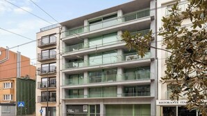 A multi-story building with balconies, a restaurant on the ground floor, and a sign for a restaurant named 'Ristorante Italia.' - Duin & Kust Residence - 50 metres from the beach, promenade and dunes (Oostduinkerke)