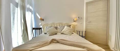 Townhome | Premium bedding, down comforters, desk, free WiFi