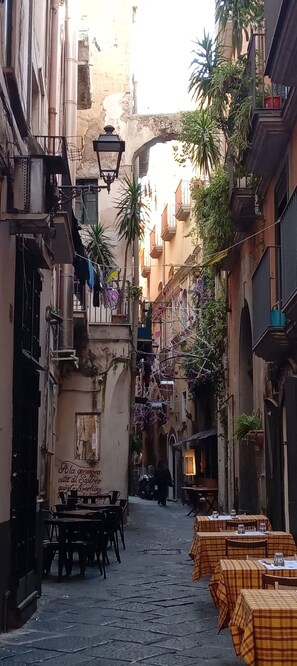 Outdoor dining - Home 56 vacation home is located in the most authentic and lively part of the city. (Salerno)
