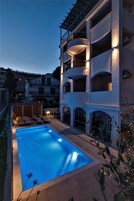 Seasonal outdoor pool, open 10:00 AM to 7:30 PM, pool umbrellas
