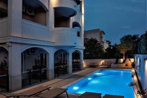 Seasonal outdoor pool, open 10:00 AM to 7:30 PM, pool umbrellas