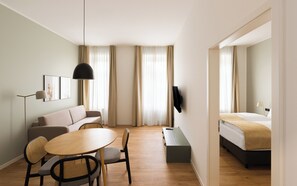 One Bedroom Suite with sofa bed | Living area | 50-inch flat-screen TV with cable channels