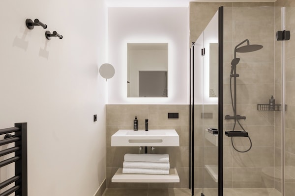 Shower, eco-friendly toiletries, hair dryer, towels