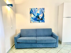 Apartamento conforto, 1 quarto, vista para o mar | Área de estar