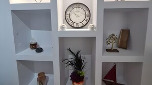 A wall with three illuminated shelves, each containing different decorative items. - Maria's Heaven House - Old Town Apartment with Private Terrace, Wi-Fi & Air Conditioning (Rodos)