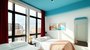 A hotel room with two beds, a large window, a painting, and a mirror.