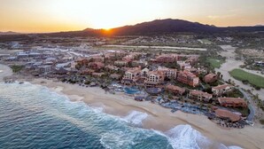 A resort with beachfront accommodations, a pool area, and a view of the ocean. - 2 BEDROOM MASTER SUITE IN HACIENDA DEL MAR LOS CABOS (Colonia del Sol)