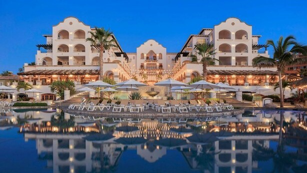 A hotel with a central courtyard, a pool, and a reflection of the building. - 2 BEDROOM MASTER SUITE IN HACIENDA DEL MAR LOS CABOS (Colonia del Sol)