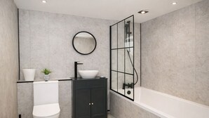 Une salle de bain moderne équipée de toilettes, d’un lavabo et d’une baignoire.