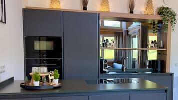 Coffee/tea maker, fridge, microwave, oven