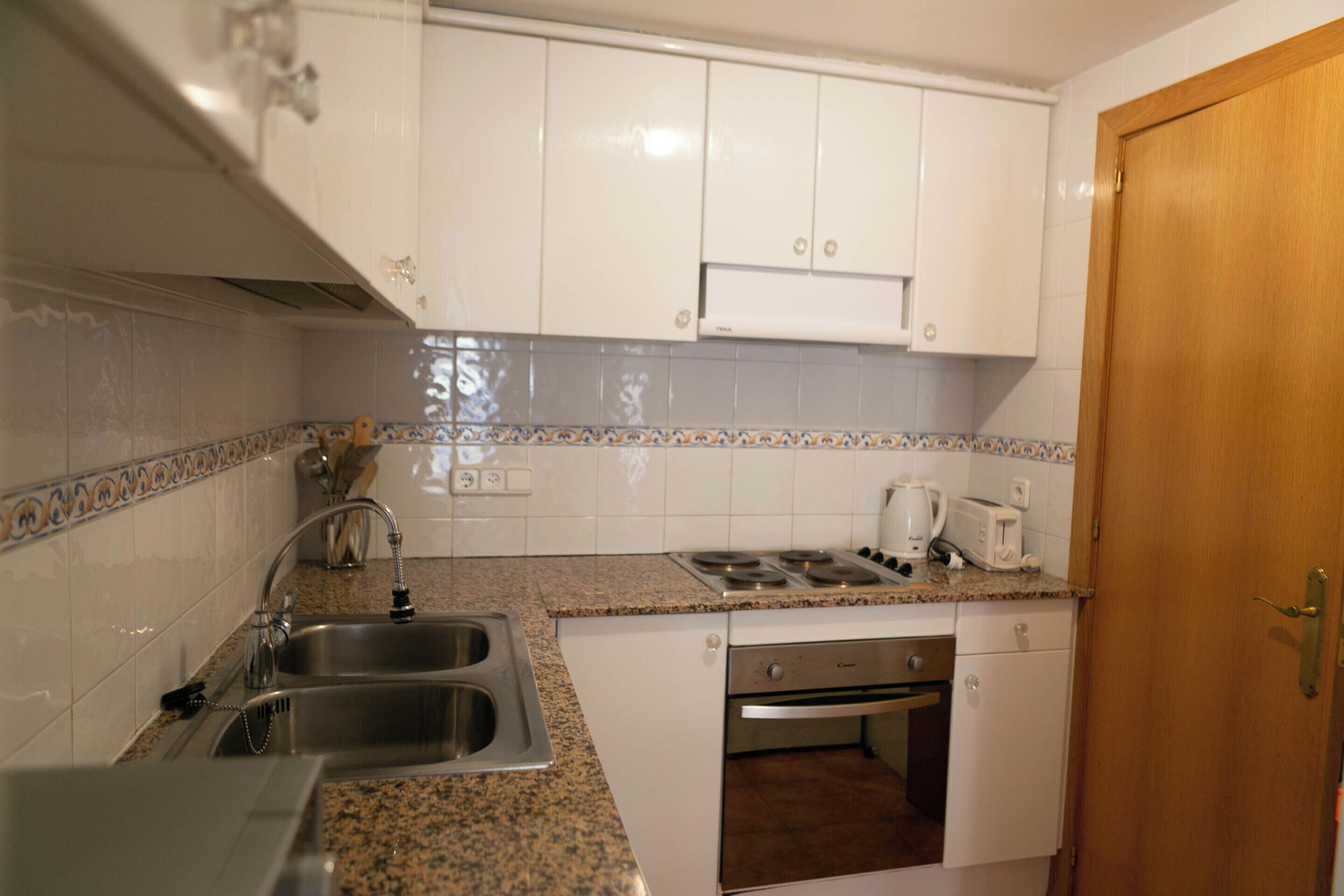 Fridge, dishwasher, dining tables