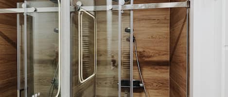 Shower, hair dryer, towels, toilet paper